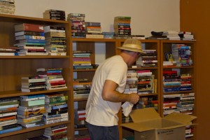 Unpacking my books.... yes I AM wearing a pith helmet.