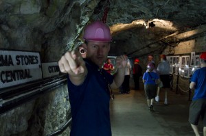 Exploring WWII tunnels in a pink hard hat...