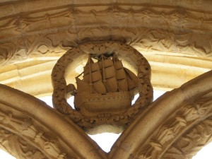 A caravel decorates the top of an arch in the cloister. This amazing new ship was capable of spanning the oceans, and it helped Portugal open the world...