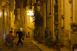 Two trick-or-treaters in the lonely nighttime streets of Birgu...