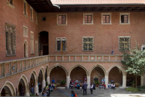 The elegant courtyard is surrounded by arches and cloisters...
