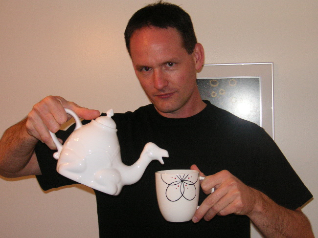 Ryan demonstrating proper usage of the camel-shaped teapot