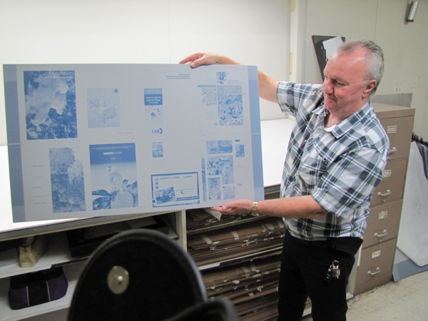 Gregg Molyneaux displays the latest proofs ready for the presses...