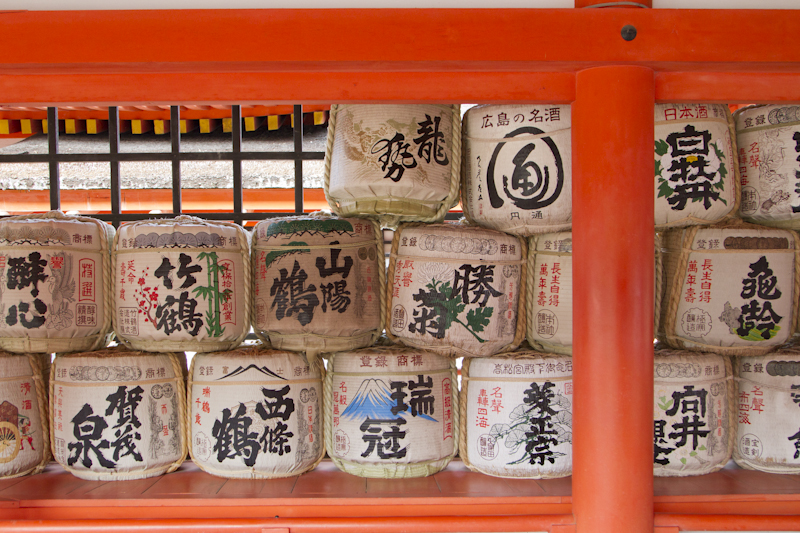 Wooden barrels of sake are left as offerings...